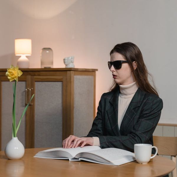 Woman feeling refreshed and balanced in a bright room.
